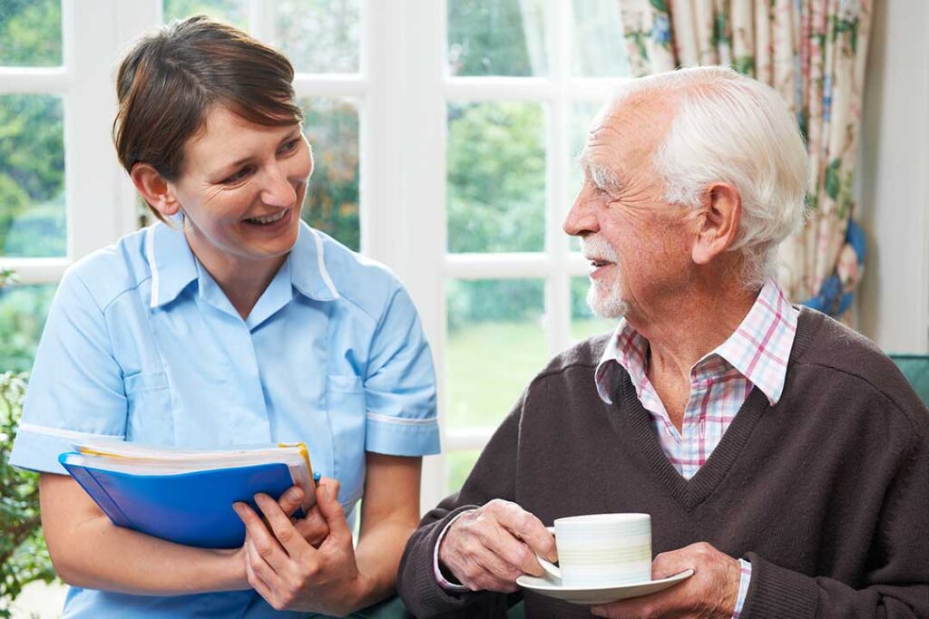 Family members tour a bright assisted living community with a staff guide and review a care checklist.